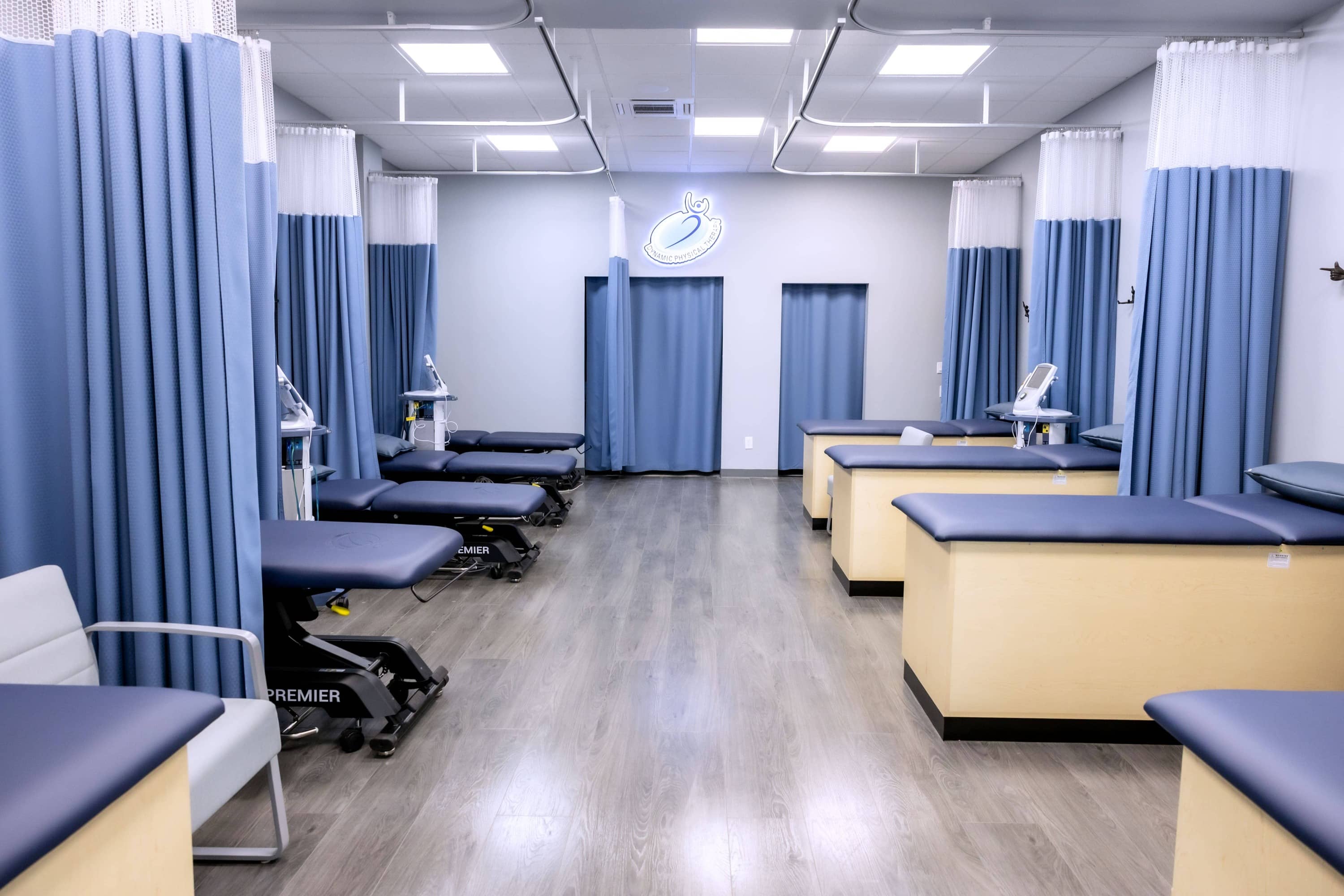 Curtained treatment bays for one-on-one care at Dynamic Physical Therapy Hicksville